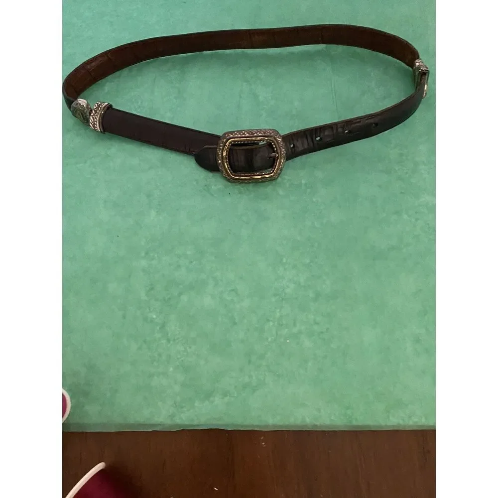 Ladies leather reversible belt black and brown with embellishments. Size med/30.